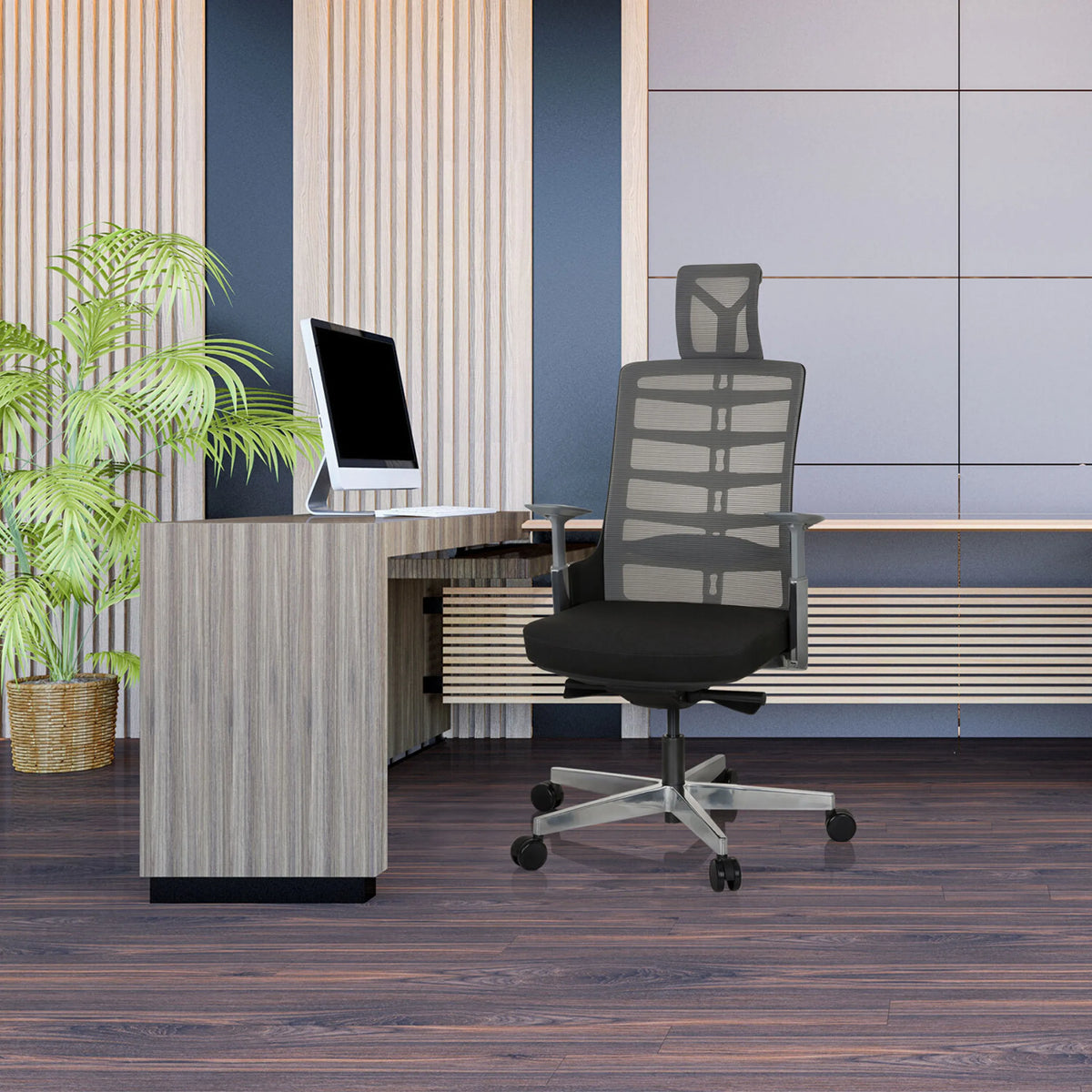 High End kontorsstol SKARIF i svart-grått framför ett skrivbord på ett modernt kontor från hjh OFFICE