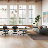 Grå Home Office kontorsstol SITMOTION B med hjul och armstöd i ett ljust kontor från hjh OFFICE
