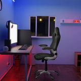 Svart GAME SPORT spelstol med armstöd vid ett skrivbord i ett upplyst rum från hjh OFFICE