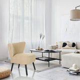 Beige Loungefåtölj MANISO med svarta ben i ett modernt inrett rum från hjh LIVING